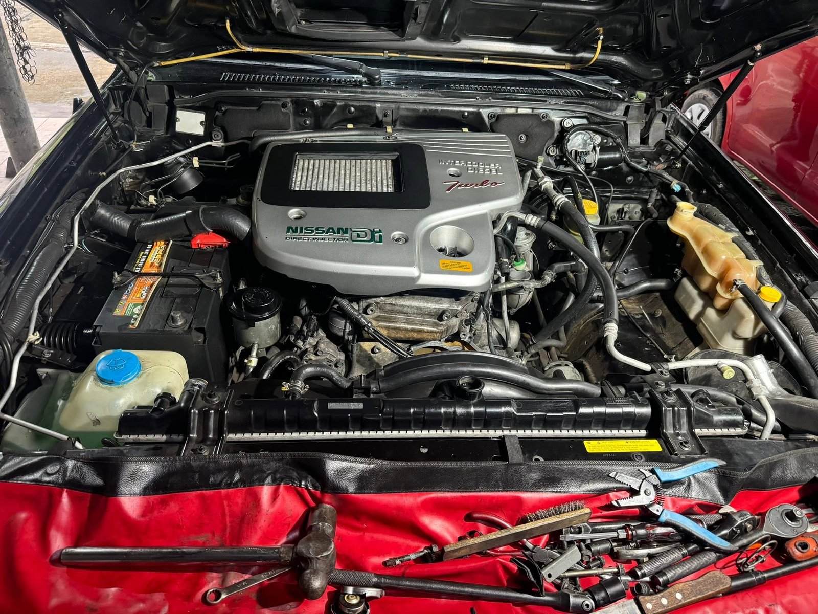 Nissan Patrol ZD30 engine bay during water pump replacement