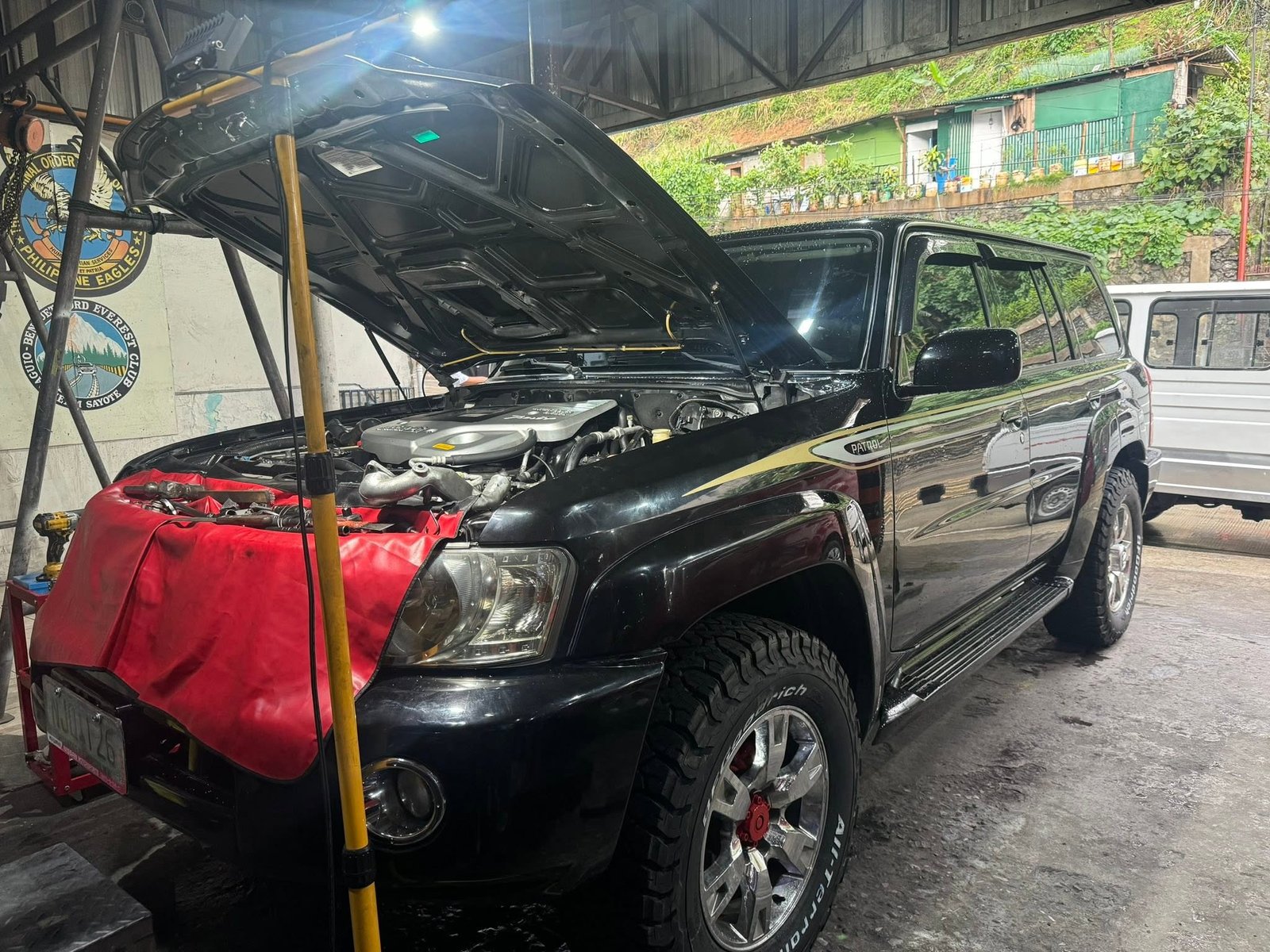 Nissan Patrol at Okayam Auto Repair Shop with hood open